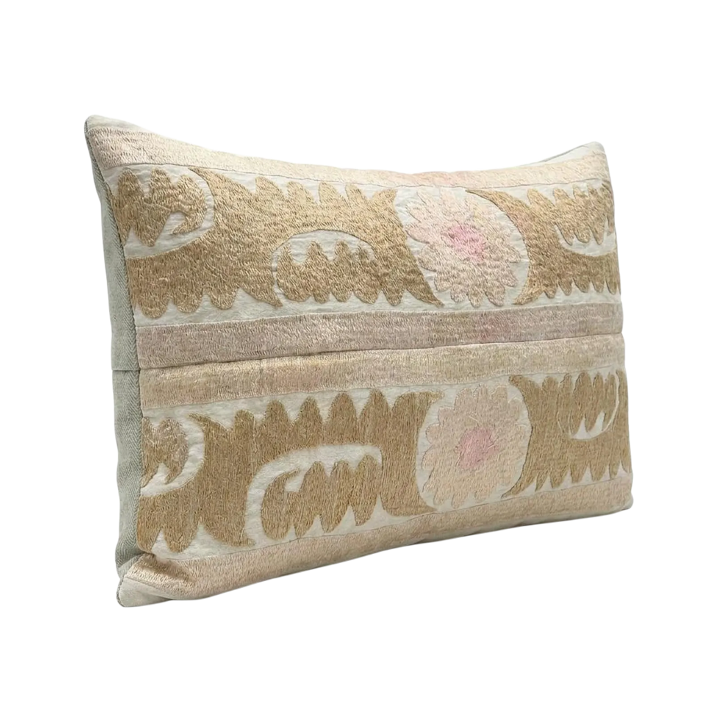 Decorative pillow with intricate patterns on a white background
