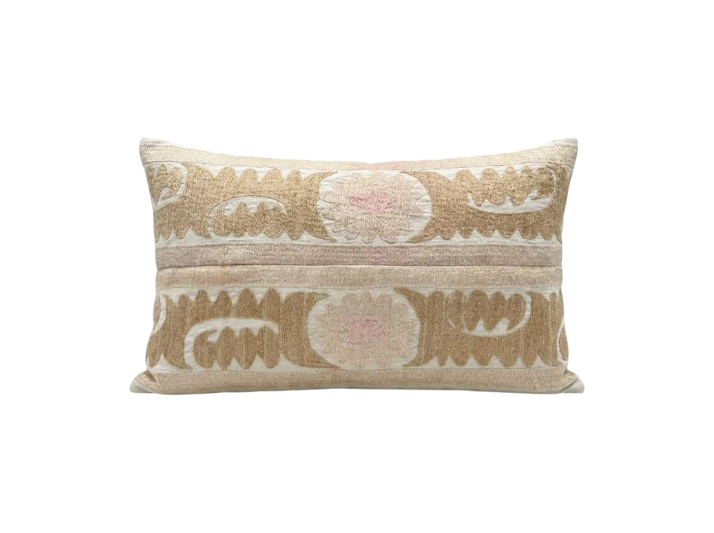 Decorative pillow with intricate patterns on a white background