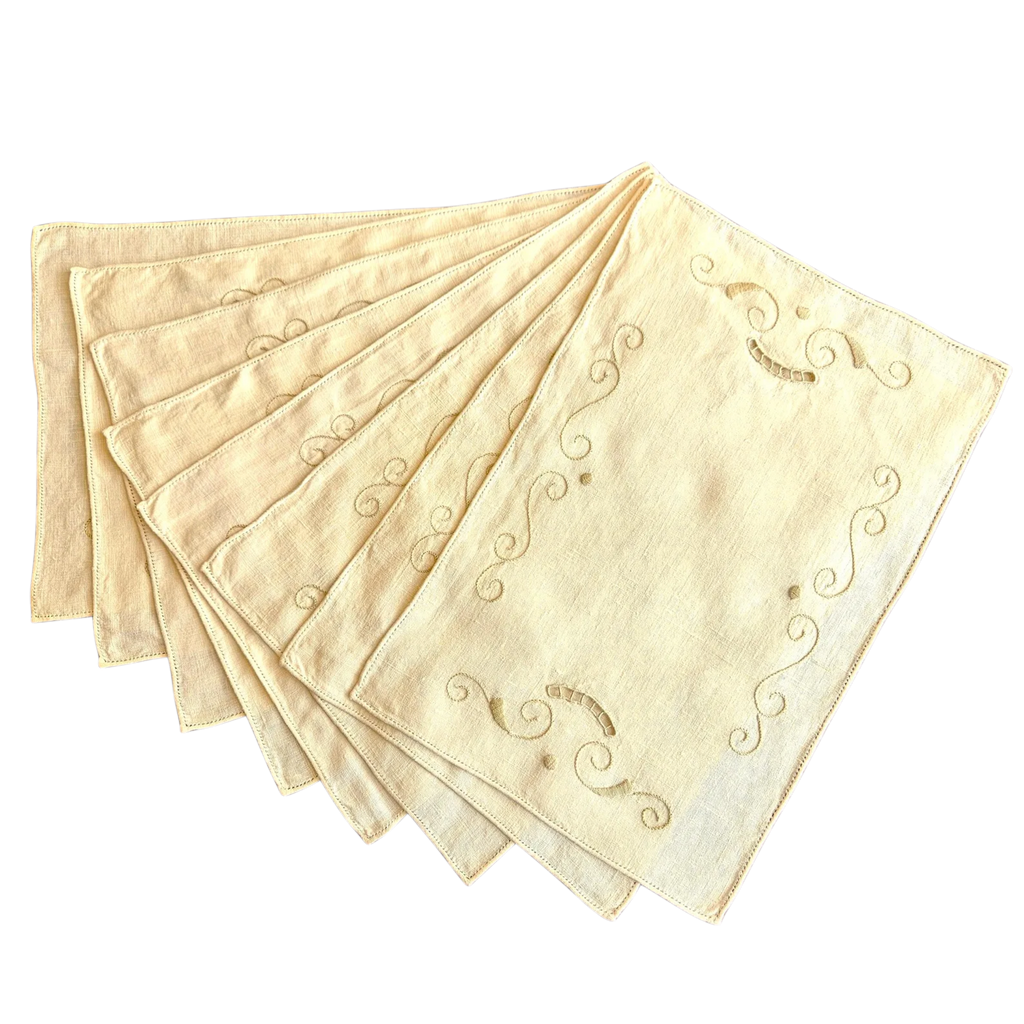 Set of 8 vintage ecru linen placemats, 40×27cm. Hand-embroidered cutwork scrolls, drawn thread hems. Excellent condition. The Home Edit by Boutique Kaotique.