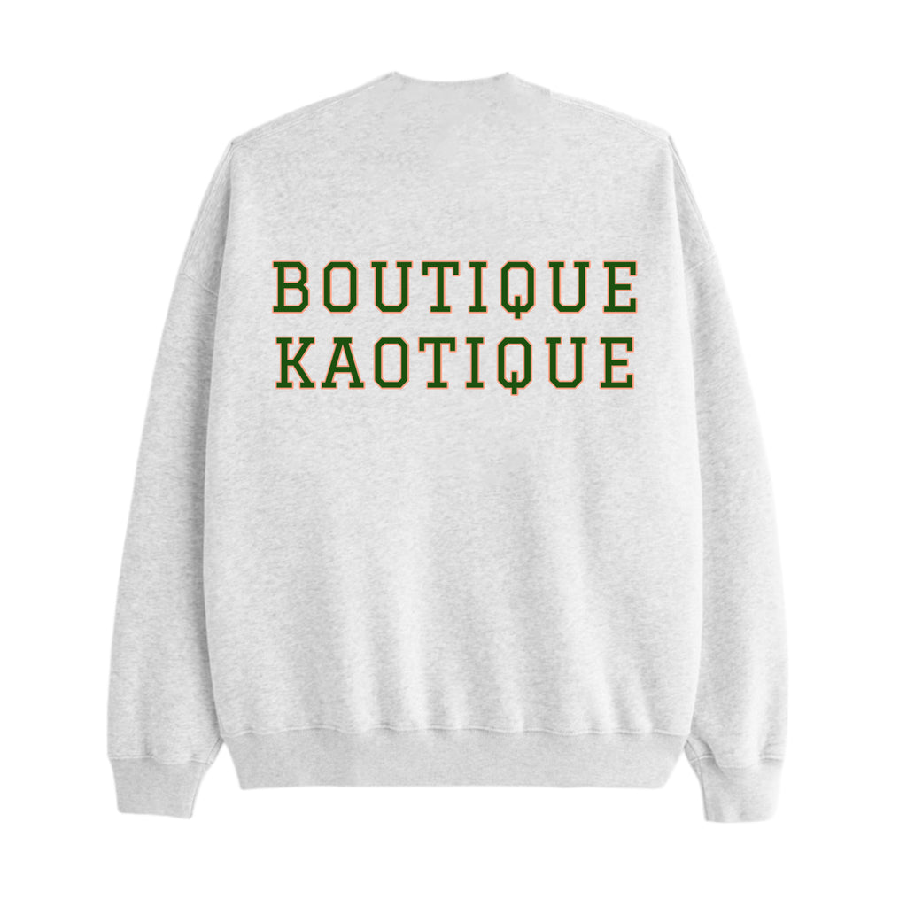 Gray sweatshirt with 'BOUTIQUE KAOTIQUE' text on the back against a white background. It Will All Work Out sweatshirt — grey 320gsm organic cotton charity sweatshirt, unisex fit, multi-cause made-to-order