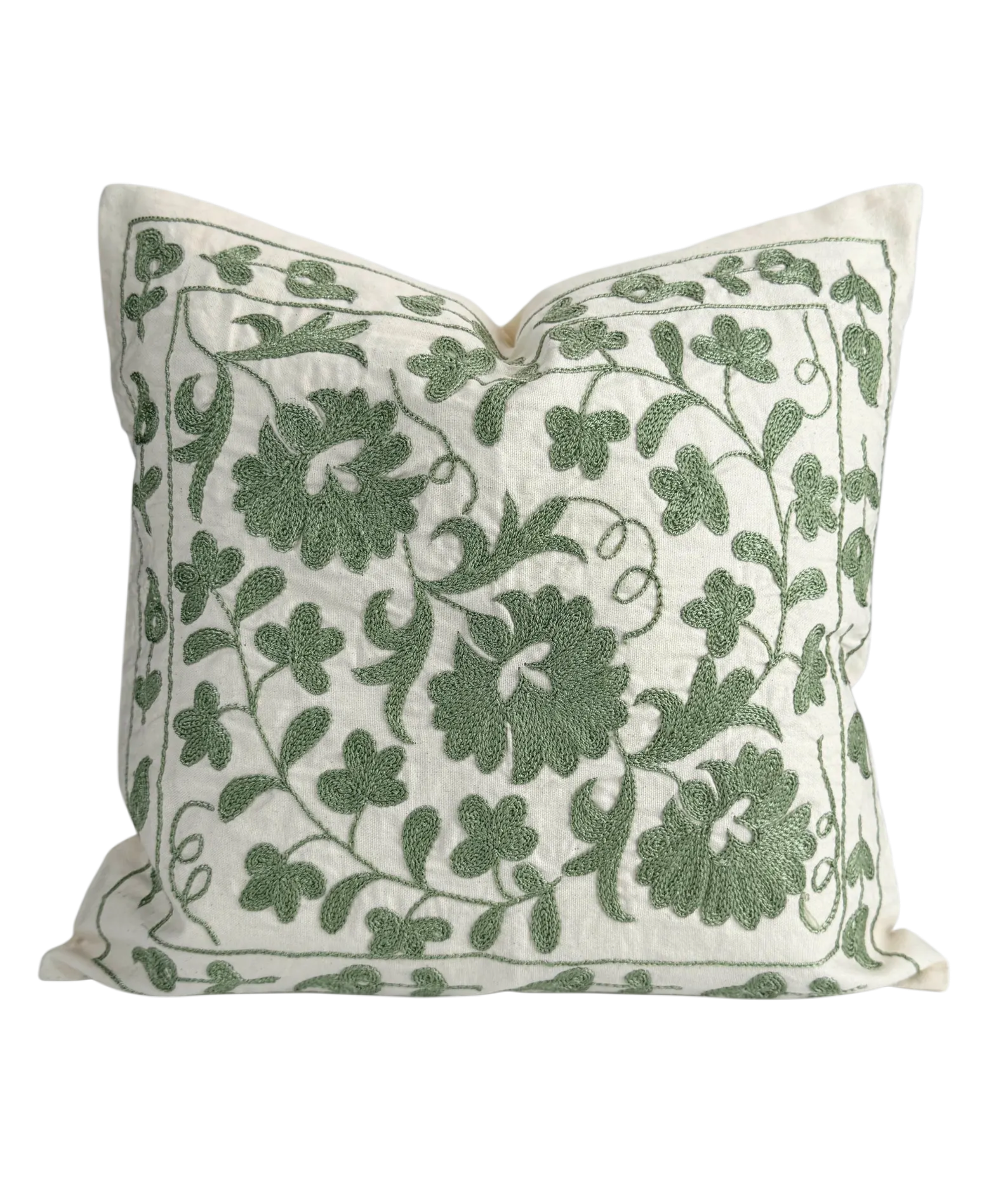 Decorative pillow with green floral pattern on a white background