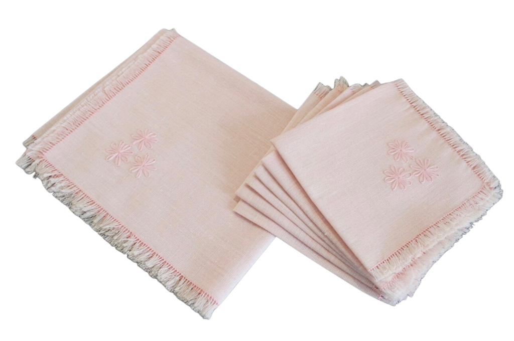 Set of pink napkins with fringe on a white background
