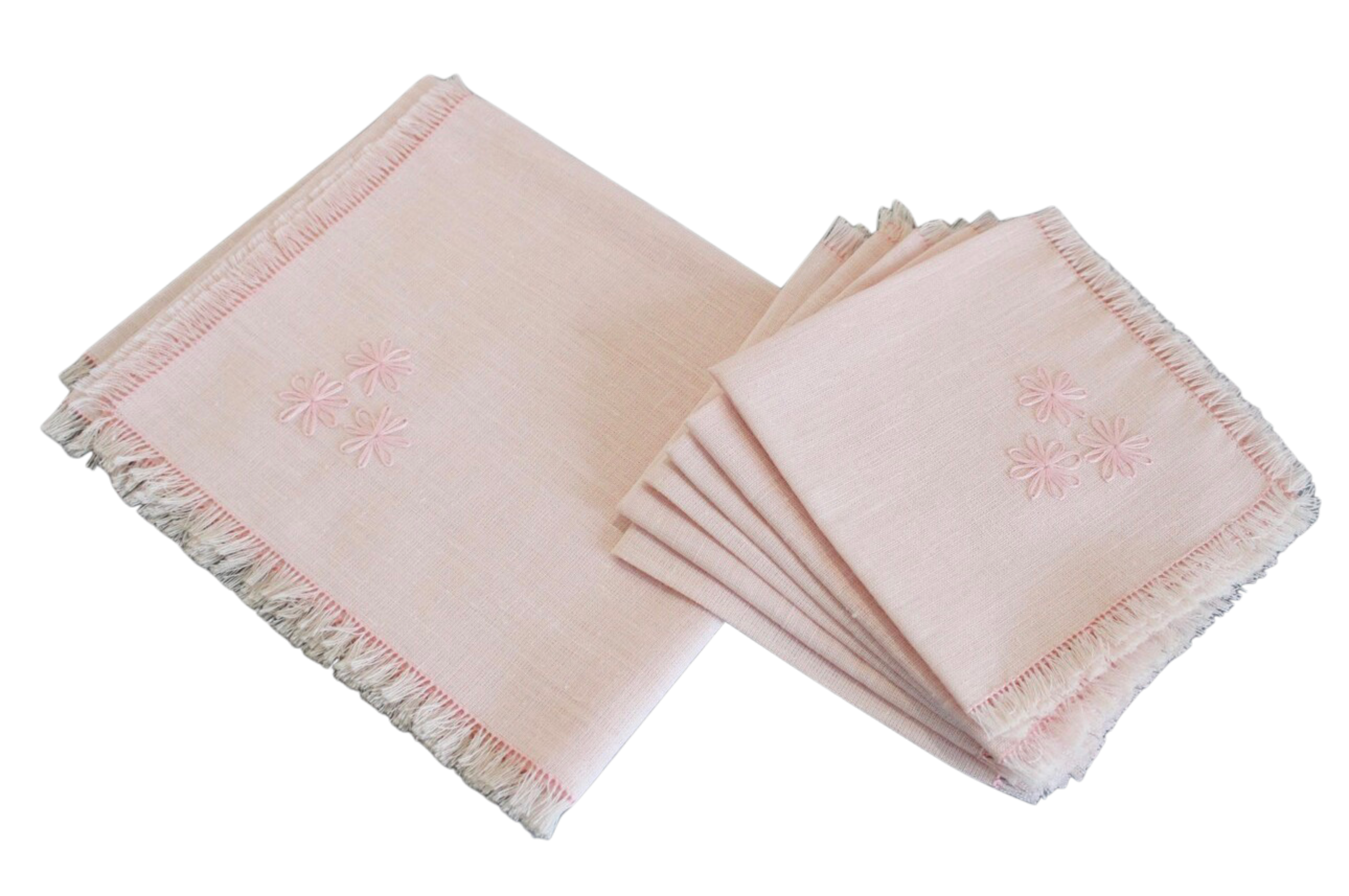 Set of pink napkins with fringe on a white background