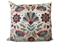 Decorative pillow with floral and leaf patterns on a white background