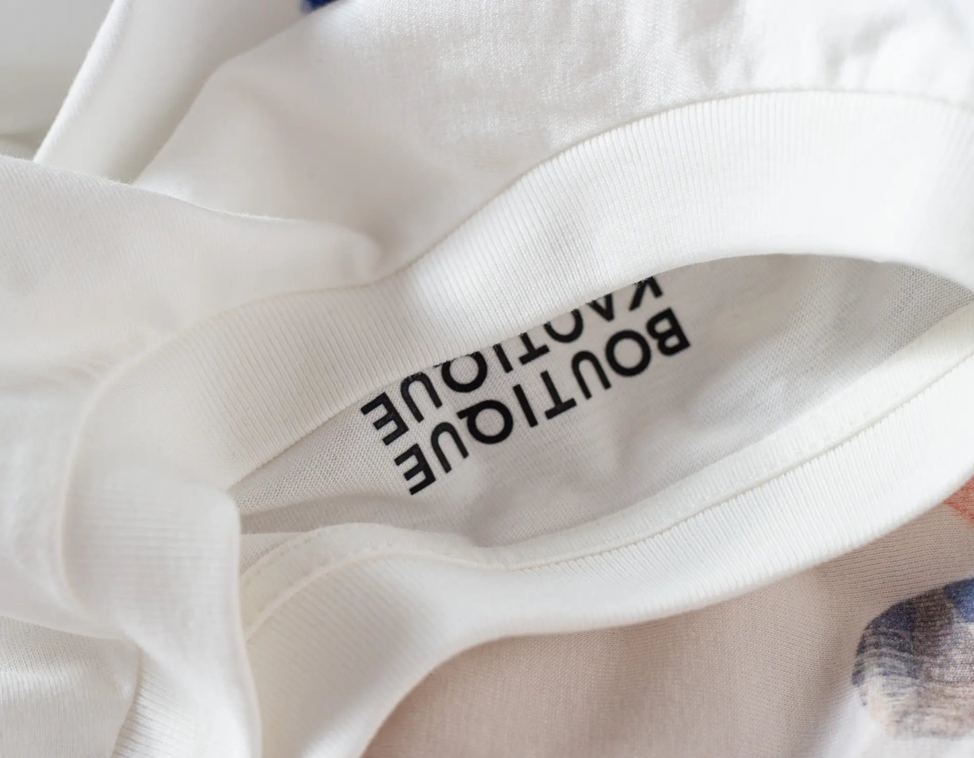 White organic cotton tshirt with boutique kaotique logo