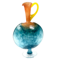 Decorative glass vase with a blue base, orange neck, and yellow handle on a white background