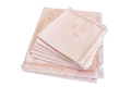 Set of pink napkins with fringe on a white background