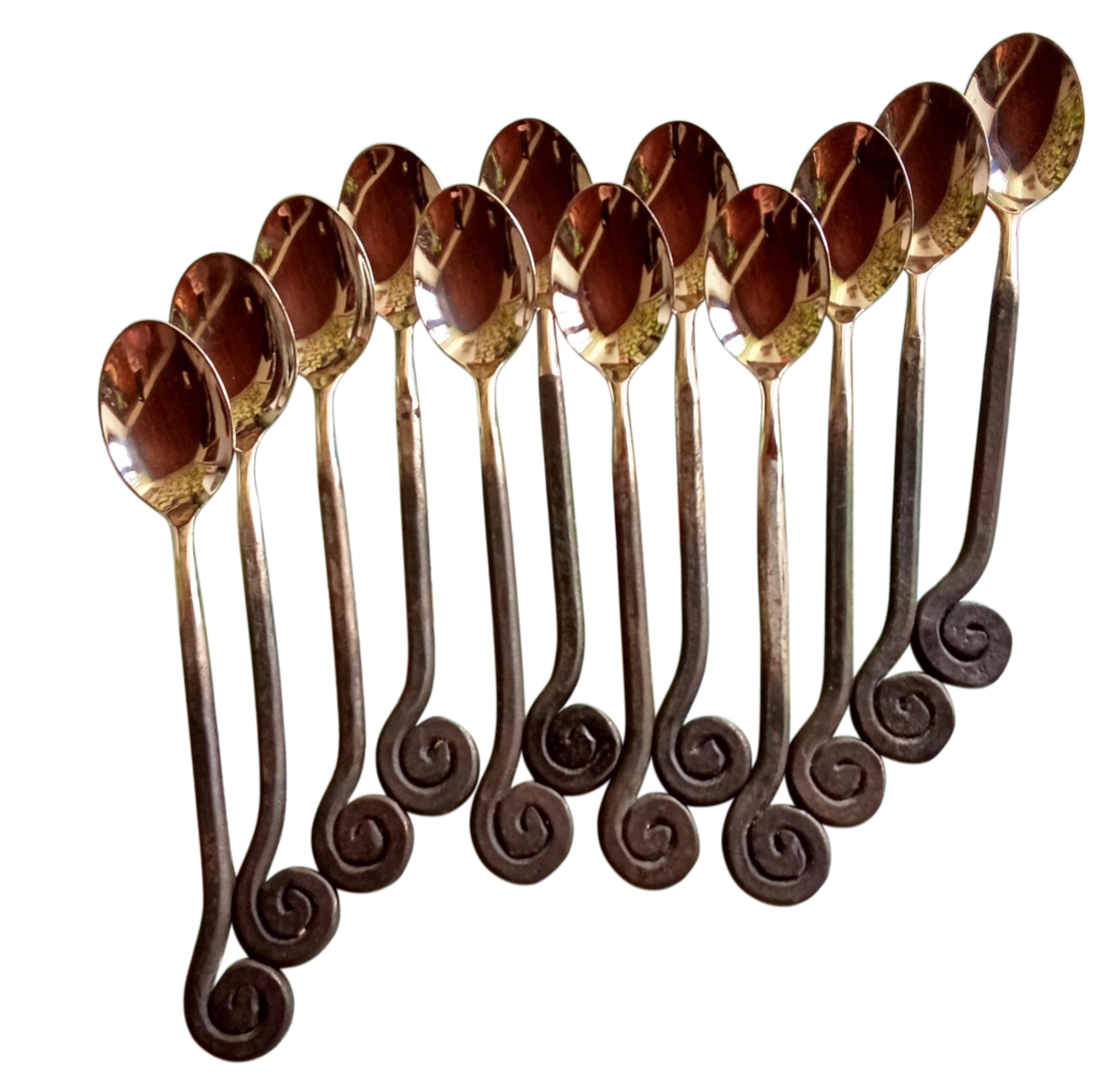 Set of decorative spoons with intricate handles on a white background