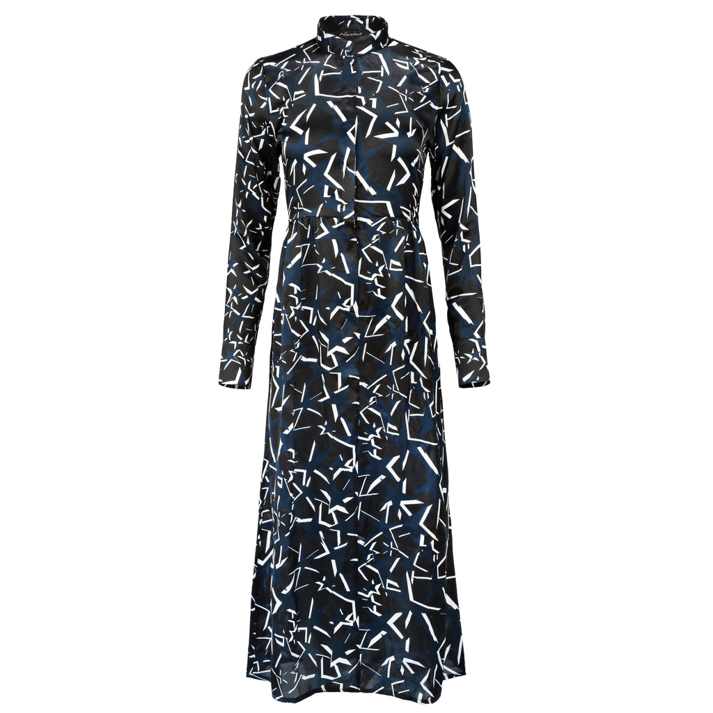 Black dress with white geometric pattern on a white background. Starry Night dress — handmade designer dress with starry print from Hanout Boutique Marrakech, fitted, limited edition occasion piece