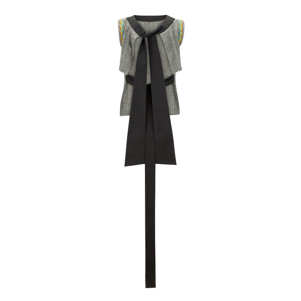 Two-tone vest with a black and gray pattern on a white background. Wool embroidered vest — handmade wool designer vest with hand-embroidery from Patrick Owen Jakarta, relaxed fit, limited edition