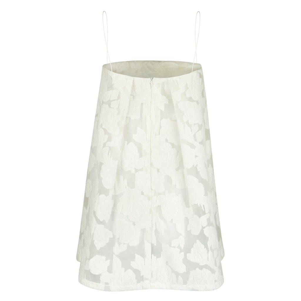 White floral patterned skirt on a white background, Indonesian lace dress top — handmade lace designer top from Maryallé Jakarta, fitted, limited edition occasion piece
