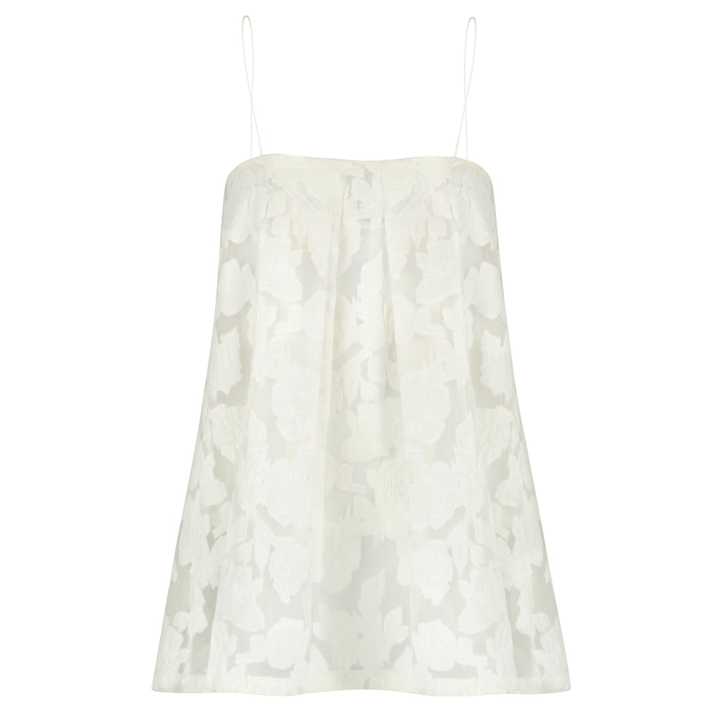 White lace dress on a white background. Indonesian lace dress top — handmade lace designer top from Maryallé Jakarta, fitted, limited edition occasion piece