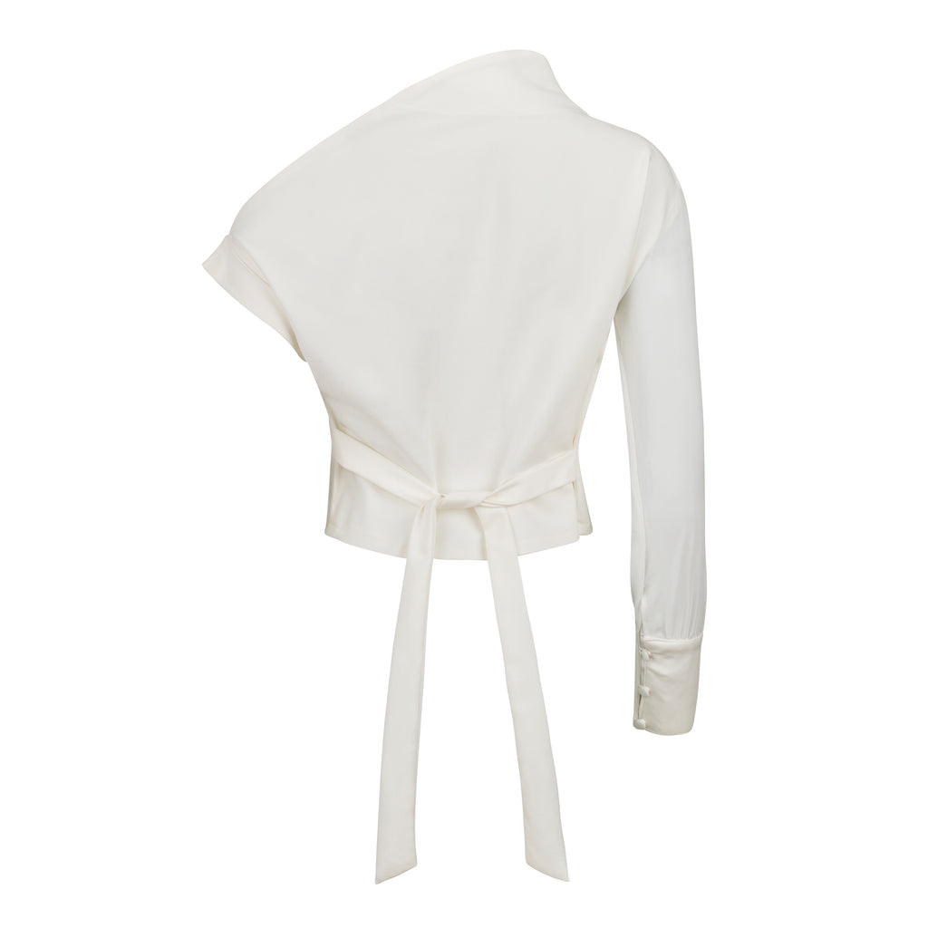 White one-shoulder top with a tie detail on a white background. Indonesian asymmetrical shirt — handmade asymmetric designer shirt from Maryallé Jakarta, fitted, limited edition piece