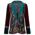 Colorful patterned jacket with a teal collar on a white background. Velvet sequins blazer — black velvet designer blazer with hand-stitched sequins from Laure Welfling Marrakech, limited edition