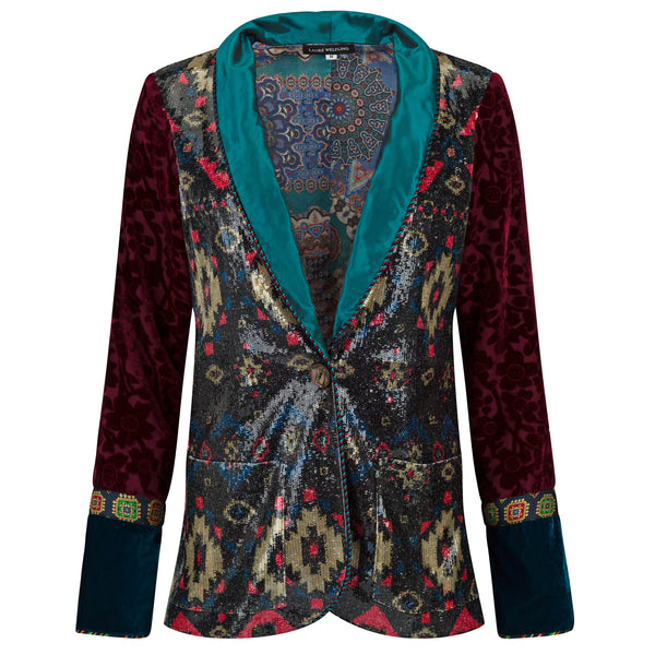 Colorful patterned jacket with a teal collar on a white background. Velvet sequins blazer — black velvet designer blazer with hand-stitched sequins from Laure Welfling Marrakech, limited edition