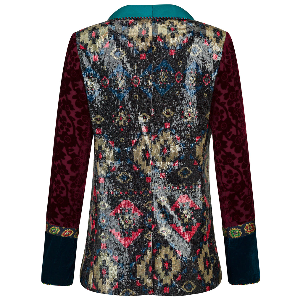 Multicolored patterned jacket with maroon sleeves on a white background. Velvet sequins blazer — black velvet designer blazer with hand-stitched sequins from Laure Welfling Marrakech, limited edition