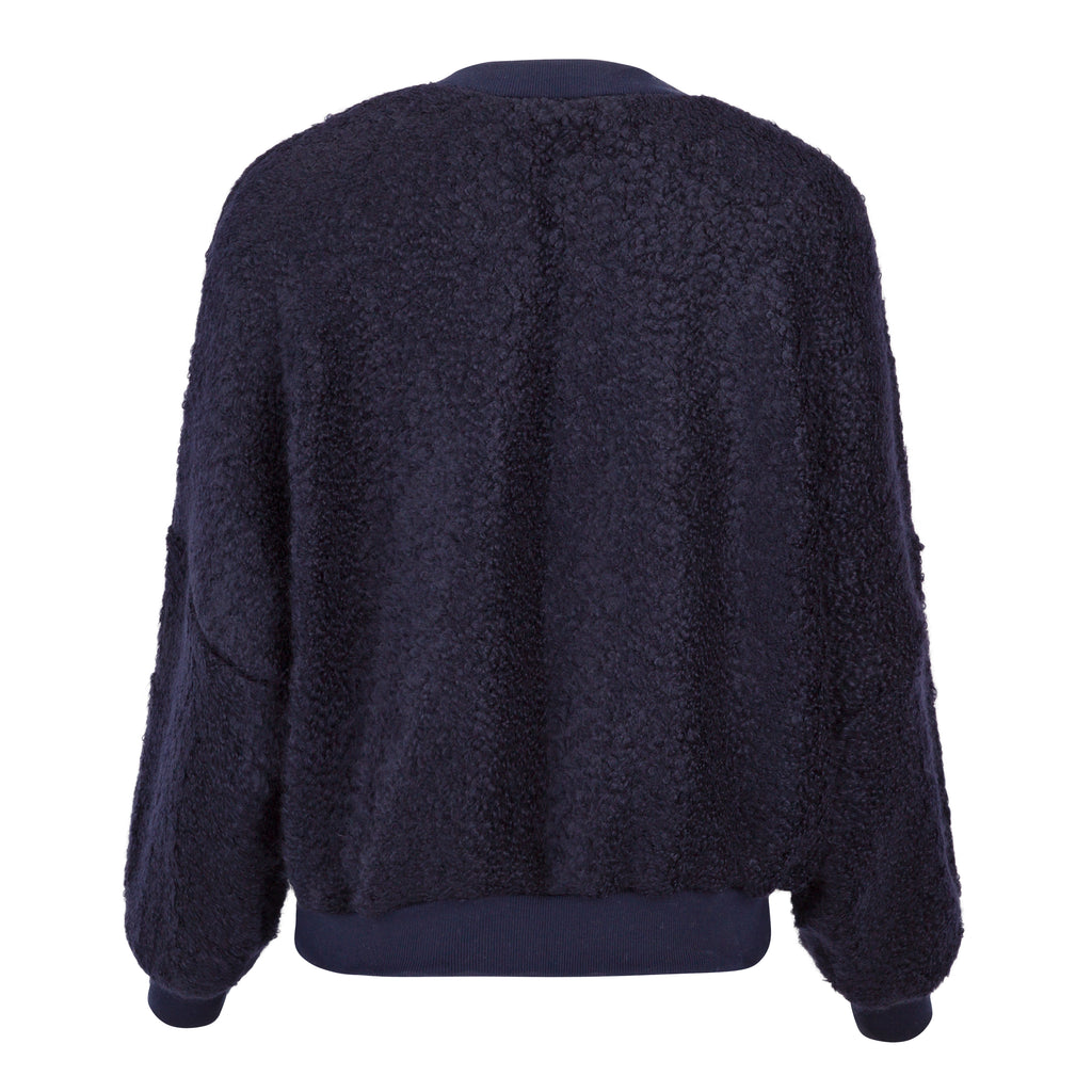 Navy blue fleece jacket shown from the back on a white background. Navy wool cashmere jumper — handmade navy wool blend designer jumper from Hanout Boutique Marrakech, relaxed fit, limited edition