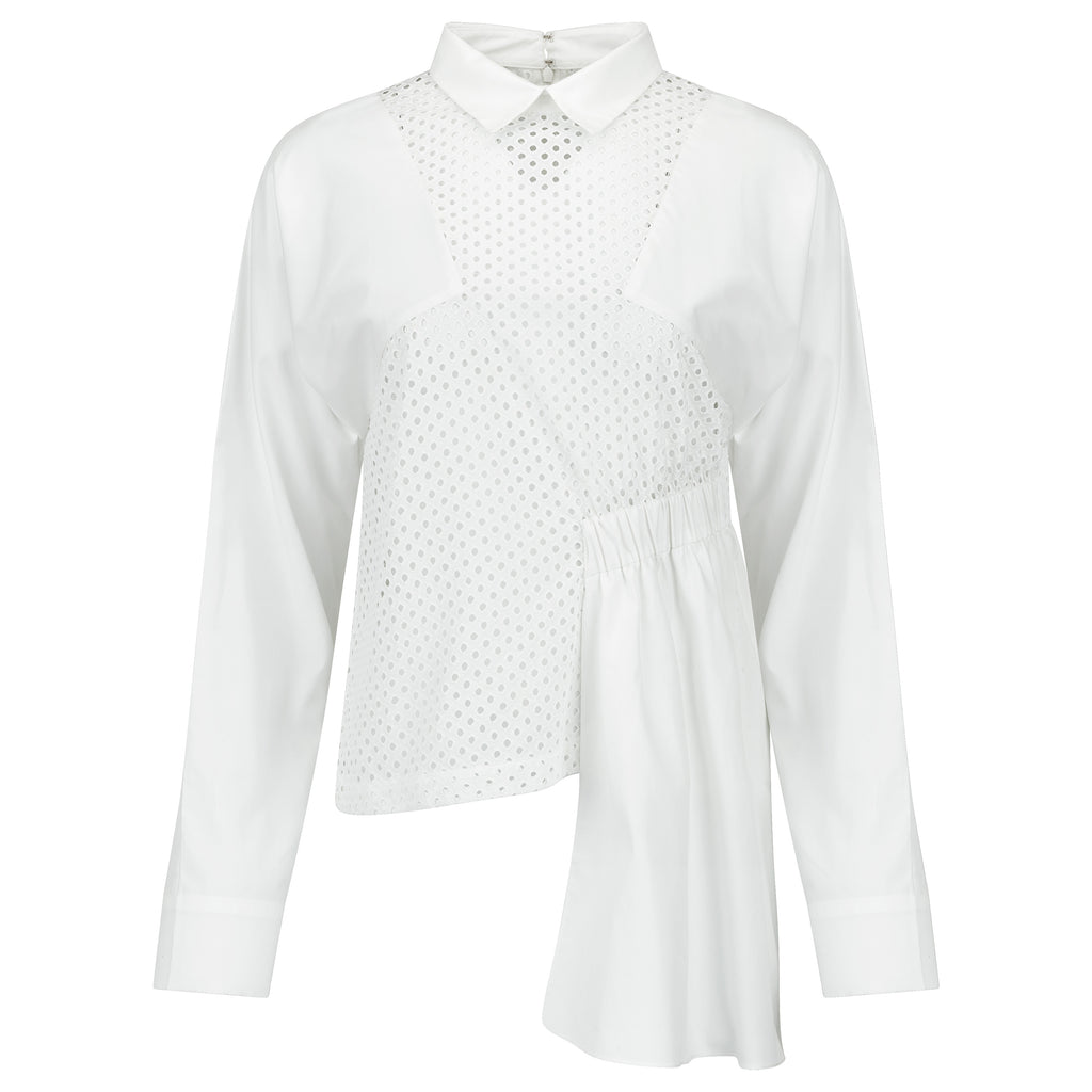 White blouse with a subtle pattern on a white background. White dotted blouse — handmade white designer blouse with delicate dot print from Major Minor Jakarta, relaxed fit, limited edition