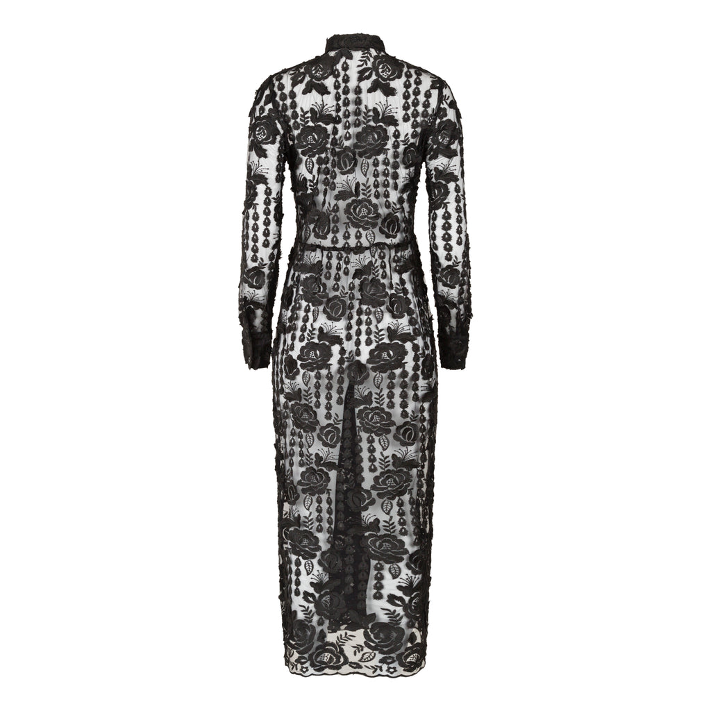 Black lace dress with floral patterns on a white background. Black lace dress — handmade black lace designer dress from Hanout Boutique Marrakech, fitted, limited edition occasion piece