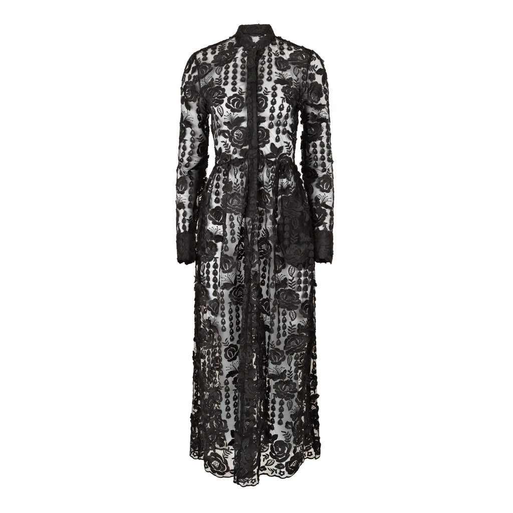 Black lace dress with floral patterns on a white background. Black lace dress — handmade black lace designer dress from Hanout Boutique Marrakech, fitted, limited edition occasion piece