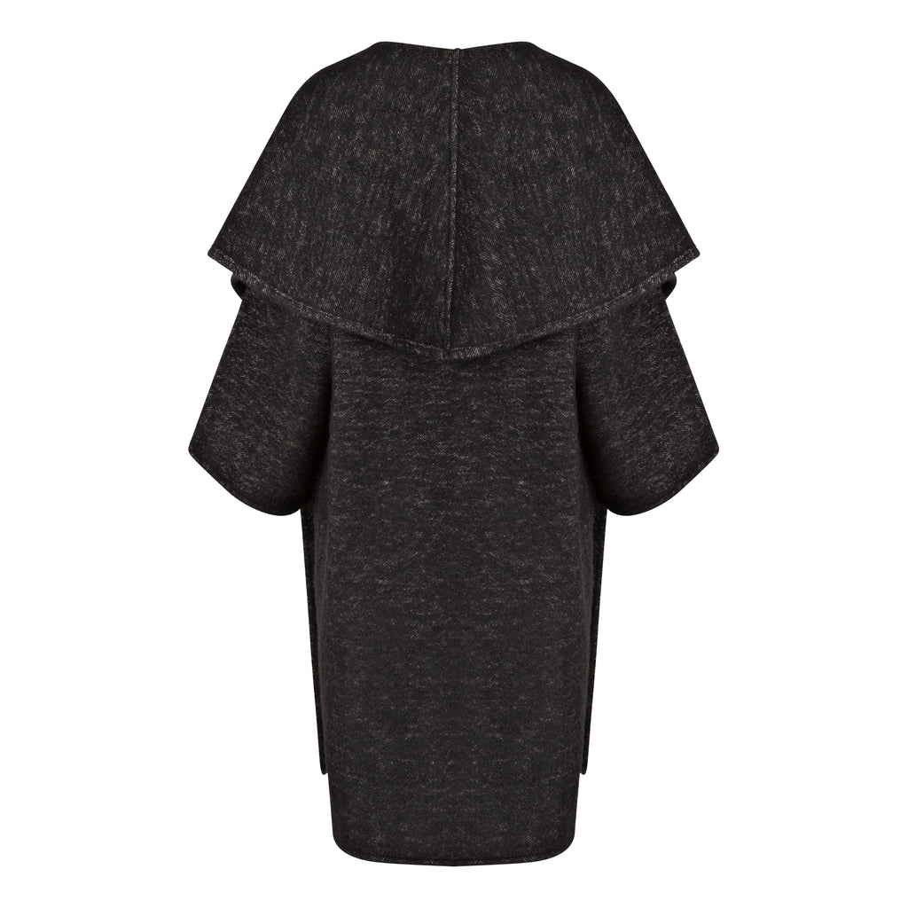 Dark gray dress with a layered design on a white background. Wool embroidered coat — heavy wool designer coat with hand-embroidered detail from Hanout Boutique Marrakech, limited edition