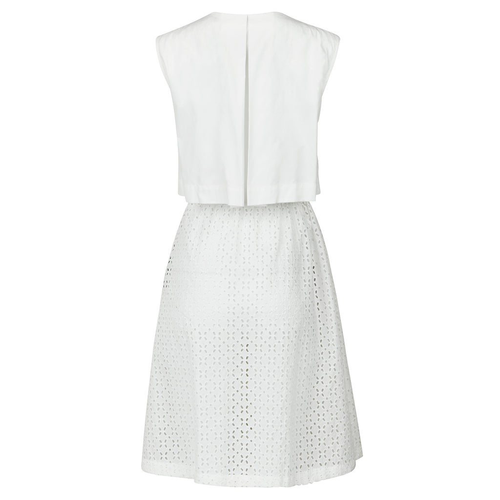White sleeveless dress with perforated skirt on a white background. Indonesian cool summer vest — handmade designer cotton summer vest from Major Minor Jakarta, relaxed fit, limited edition