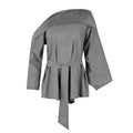 Gray blouse with a belt on a white background. Indonesian asymmetrical blouse — handmade asymmetric designer blouse from Maryallé Jakarta, fitted, limited edition piece