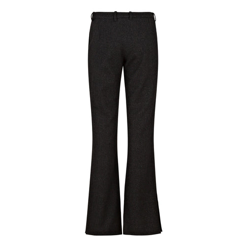 Black flared pants on a white background. Flared wool trousers — handmade designer flared wool trousers from Patrick Owen Jakarta, relaxed fit, limited edition winter piece