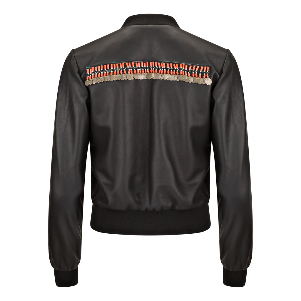 Black bomber jacket with decorative elements on the back against a white background. Jewelled biker jacket — handmade designer biker jacket with jewel detailing from Hanout Boutique Marrakech, fitted, limited edition