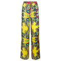 Colorful patterned pants on a white background. Yellow patterned silk pants — handmade yellow silk designer pants with groovy print from Hanout Boutique Marrakech, relaxed fit