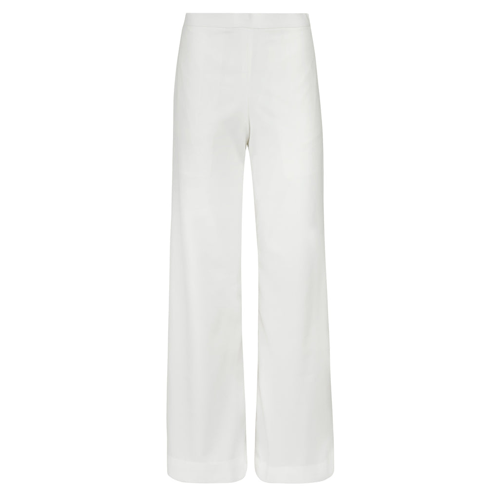 White wide-leg pants on a white background. Double coloured trousers — handmade designer two-tone trousers from Major Minor Jakarta, relaxed fit, limited edition piece