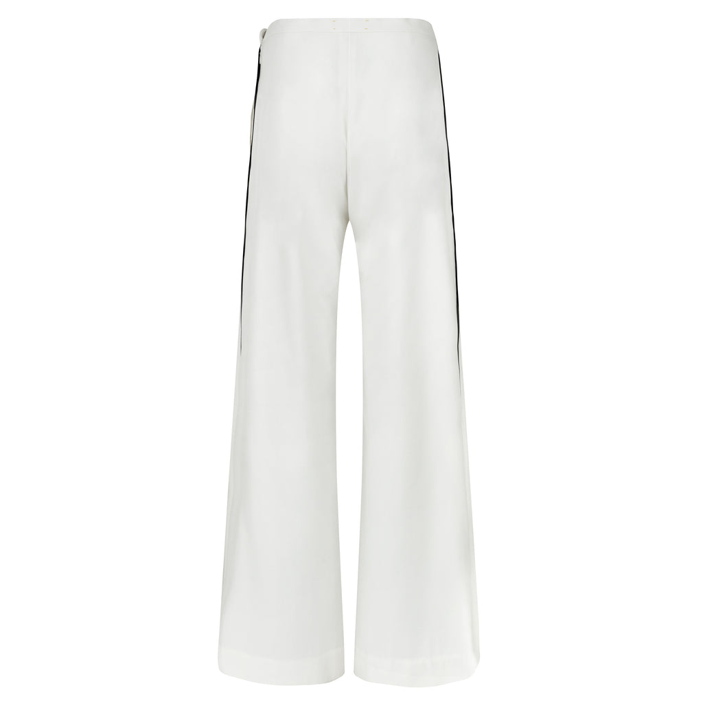 White wide-leg pants on a white background. Extra loose trousers — handmade designer relaxed trousers from Major Minor Jakarta, oversized fit, limited edition summer