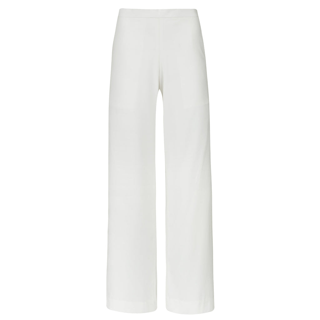 White pants on a white background. Extra loose trousers — handmade designer relaxed trousers from Major Minor Jakarta, oversized fit, limited edition summer