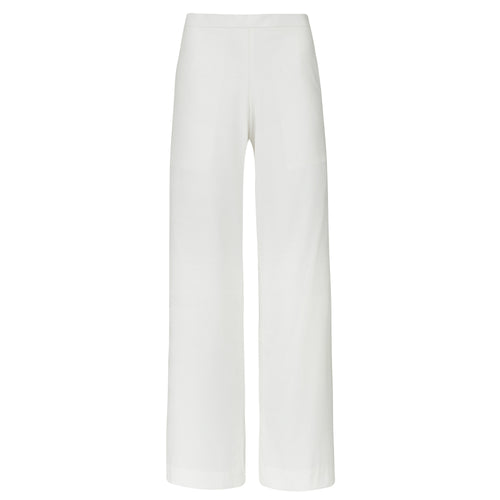 White pants on a white background. Extra loose trousers — handmade designer relaxed trousers from Major Minor Jakarta, oversized fit, limited edition summer