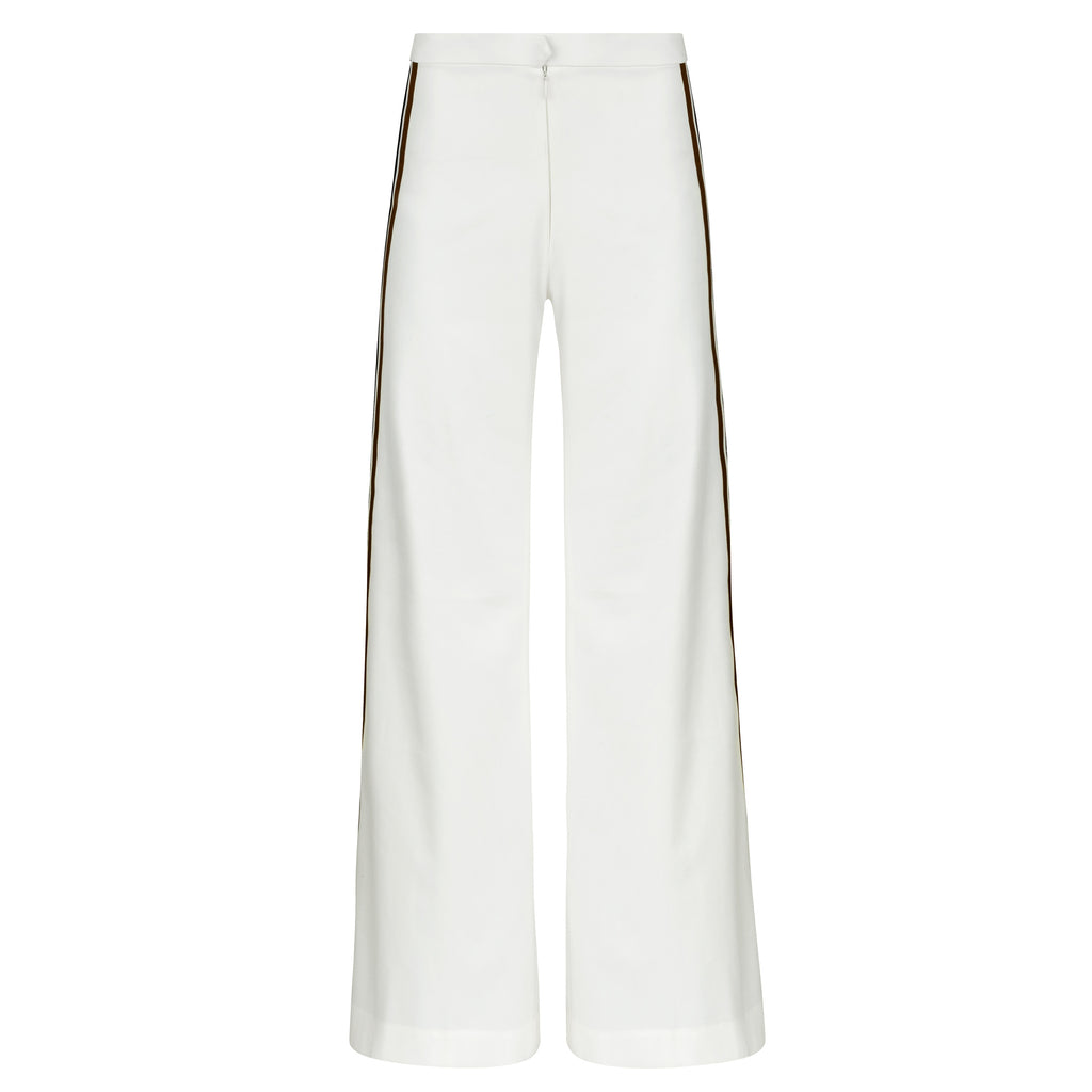 White pants with a subtle pattern on a white background. Striped trousers — handmade designer striped cotton trousers from Major Minor Jakarta, relaxed fit, limited edition summer