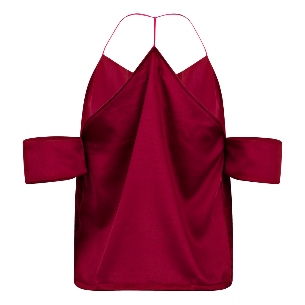 Red dress with thin straps on a white background. Cut out burgundy top — handmade burgundy designer top with cut-out detail from Maryallé Jakarta, fitted, limited edition