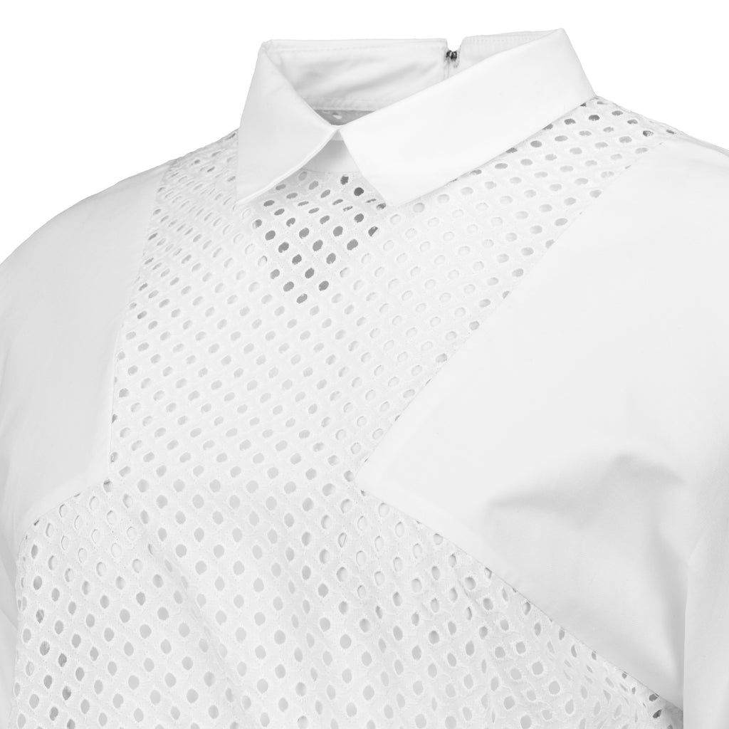 White shirt with perforated design on a white background. White dotted blouse — handmade white designer blouse with delicate dot print from Major Minor Jakarta, relaxed fit, limited edition