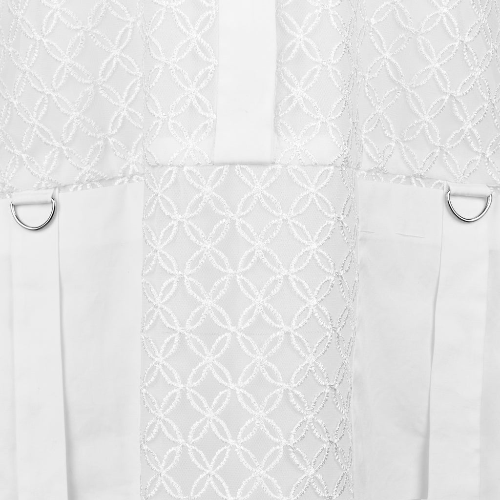 White textured fabric with geometric pattern and metal rings on a white background. Indonesian cool summer dress — handmade designer cotton summer dress from Major Minor Jakarta, relaxed fit, limited edition