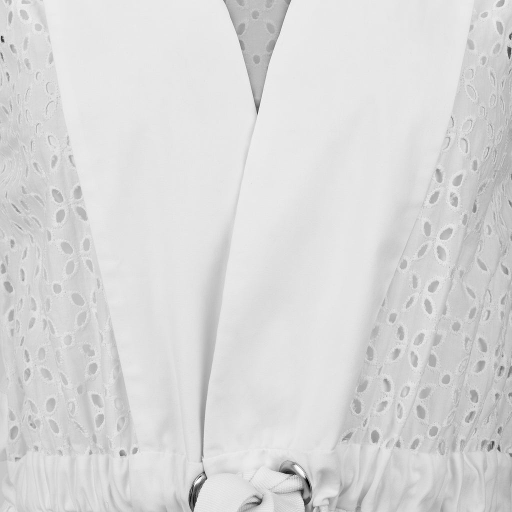 White lace curtain with floral patterns on a white background. Indonesian cool summer vest — handmade designer cotton summer vest from Major Minor Jakarta, relaxed fit, limited edition