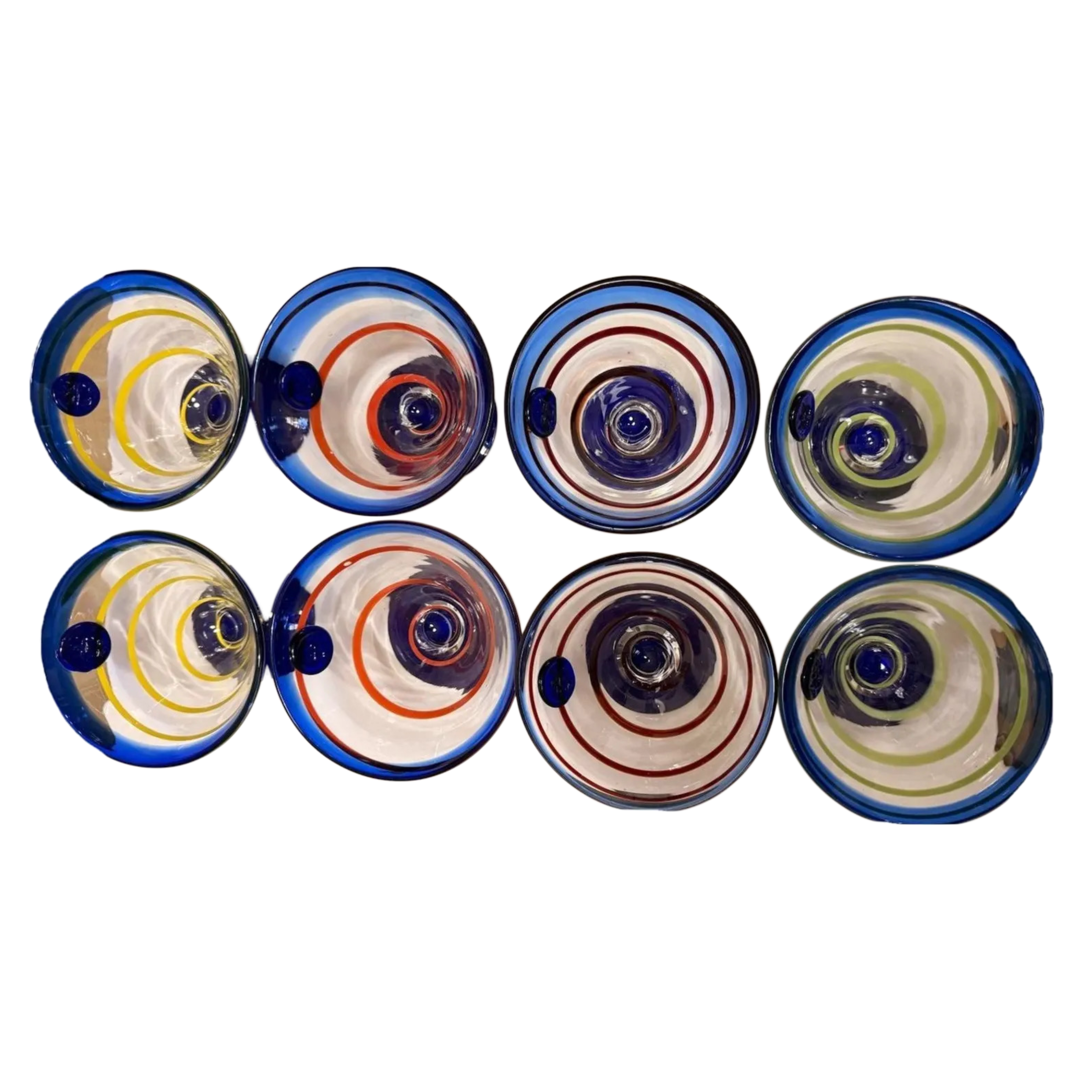 Rare full set of 8 Kosta Boda Royal Caribbean martini glasses. Hand-blown, cobalt base, mixed swirl colours. No longer made. The Home Edit by Boutique Kaotique.