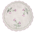 Round embroidered cloth with pink flowers and green leaves on a white background. Platemat