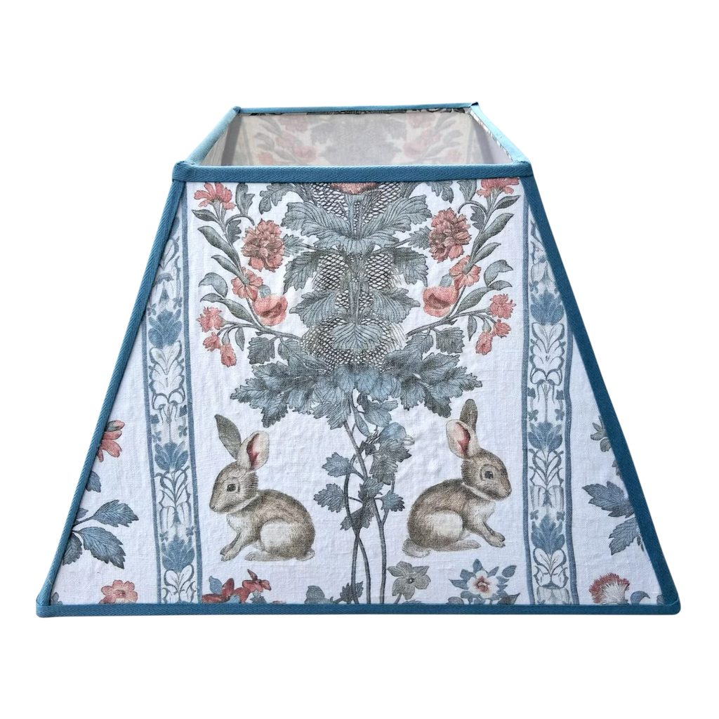 Decorative lampshade with floral and rabbit pattern on a white background