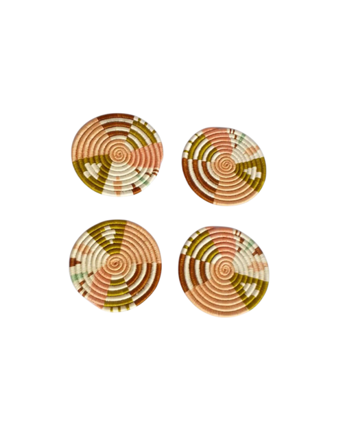 Set of four Nziza handwoven natural sisal and grass coasters made by female artisans in Rwanda, earthy tones, unique woven patterns, Boutique Kaotique Home Edit