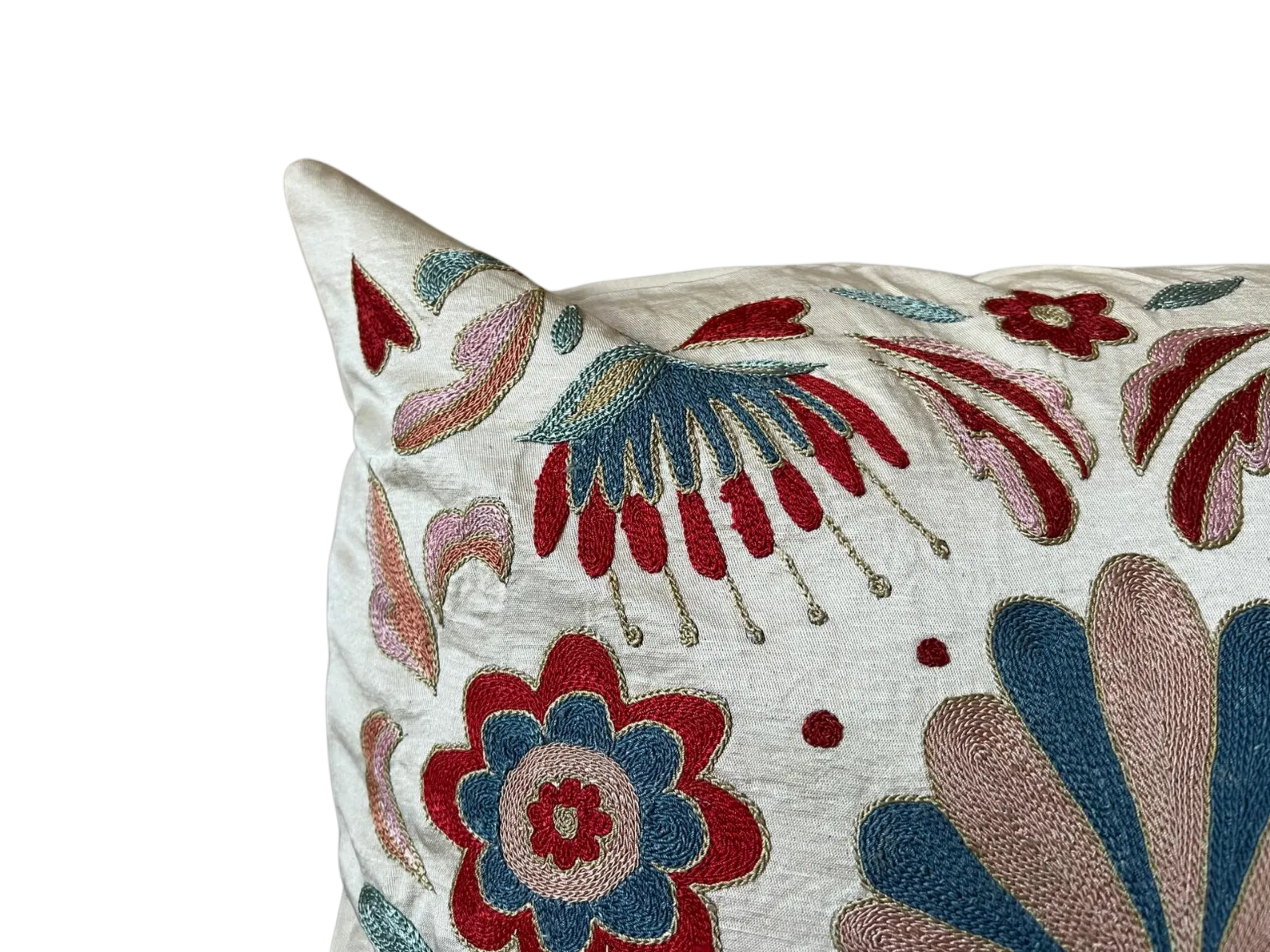 Decorative pillow with floral embroidery on a white background
