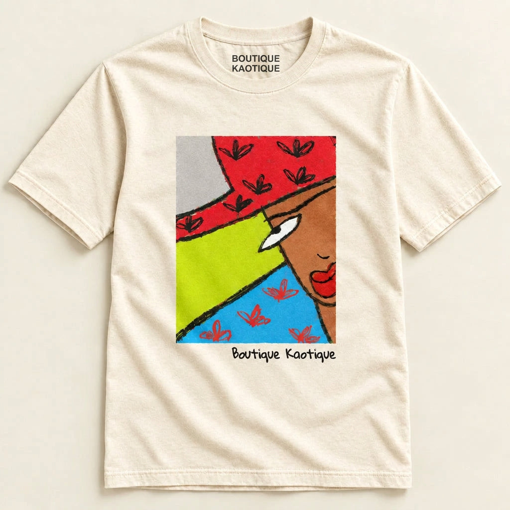 A organic cotton t-shirt with a colorful abstract graphic print on the front, including the text 'Boutique Kastine'. The brand 'BOKA' is visible at the top. The Side Eye affirmation tee — white organic cotton t-shirt with playful print, unisex fit, gender equality charity tee