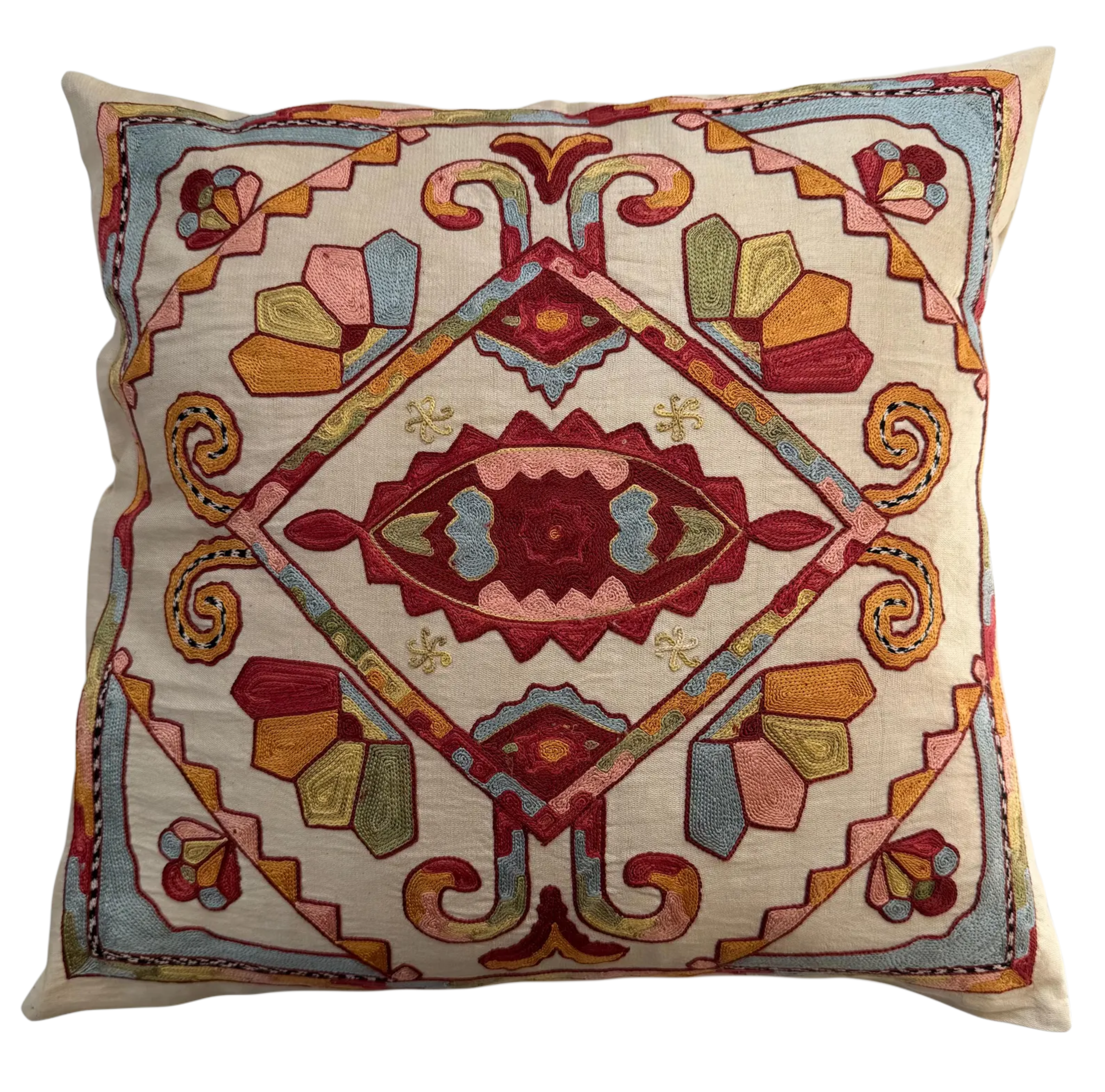 Decorative pillow with intricate geometric pattern on a beige background