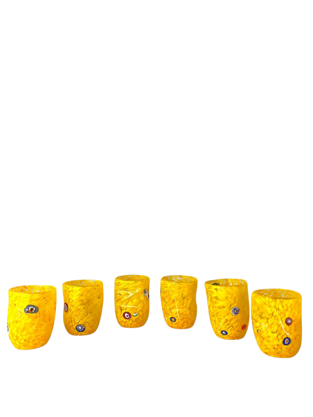 Set of six yellow textured glass tumblers on a white background
