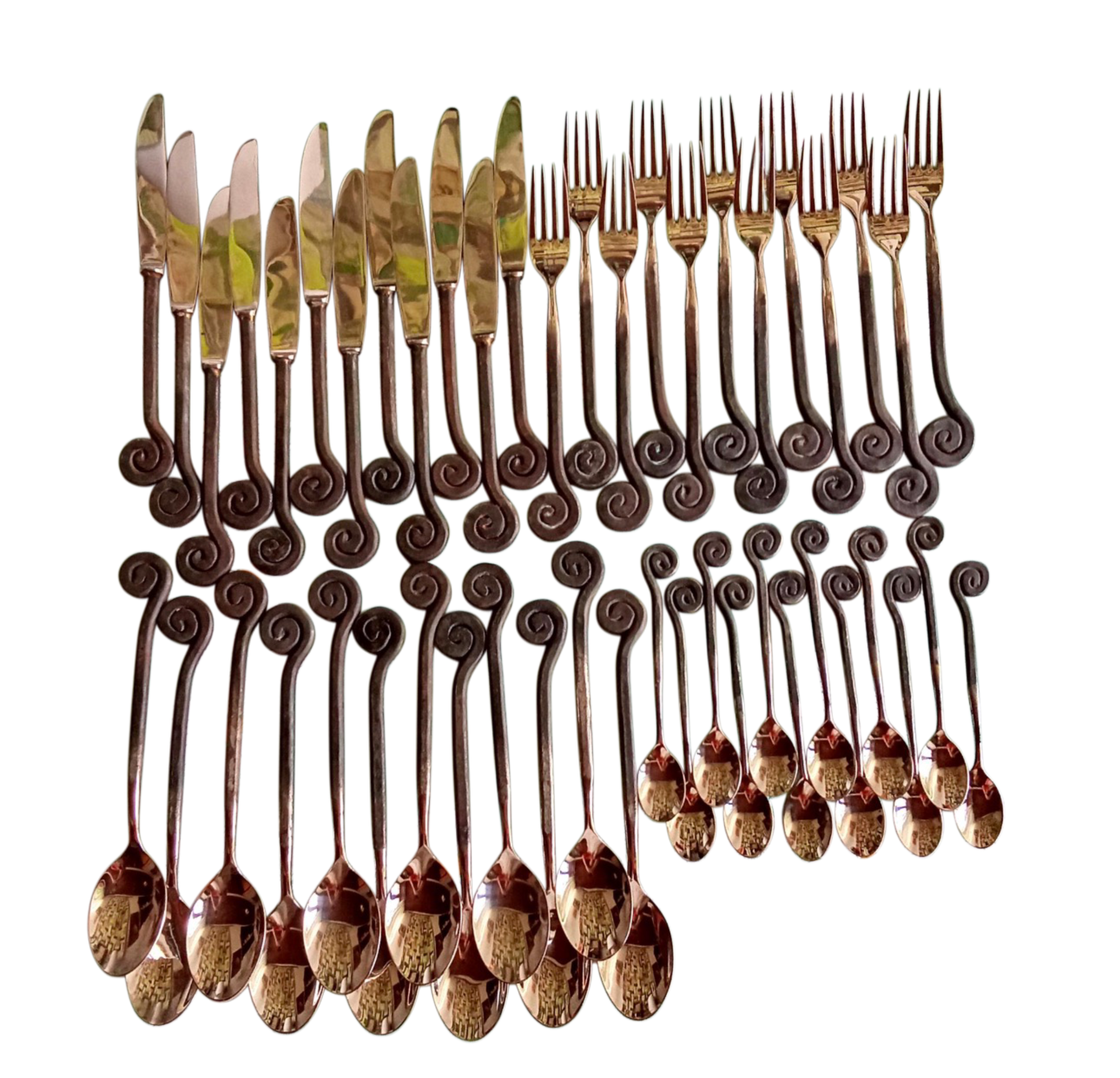 Set of decorative cutlery including knives, forks, and spoons on a white background