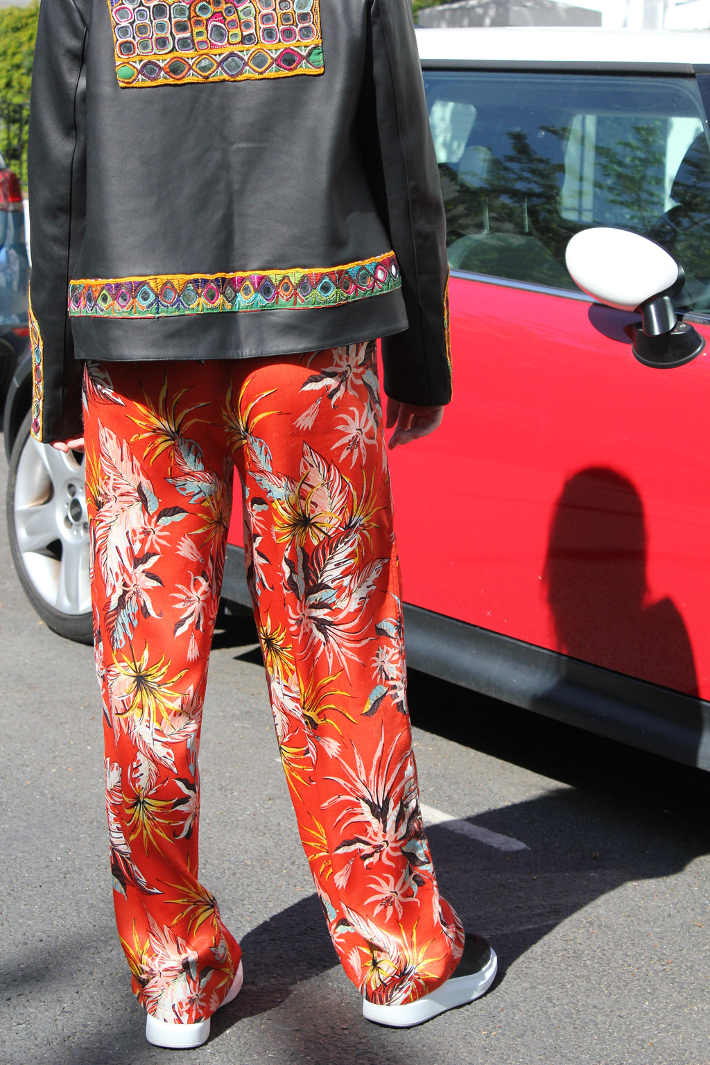 Orange patterned silk pants — handmade orange silk designer pants with vibrant print from Hanout Boutique Marrakech, relaxed fit