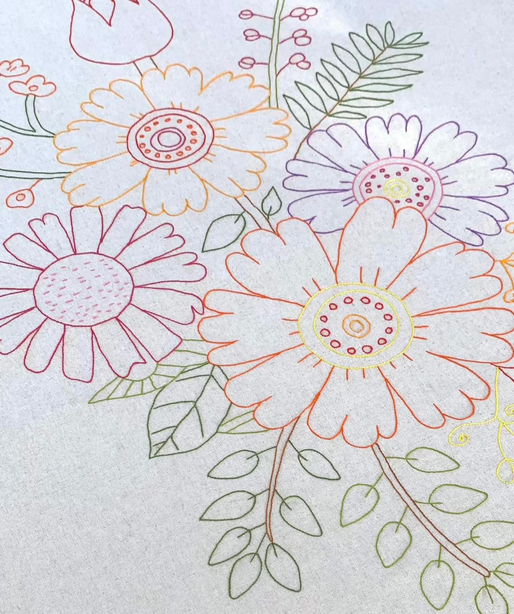 Colorful floral embroidery design on a light background tablecloth